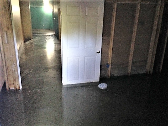 water damage on floor of bank foreclosed home