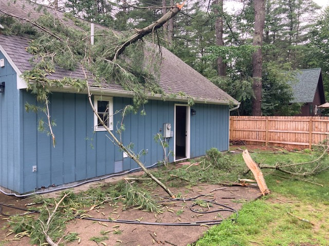 Storm damage sustained after tree fell through room
