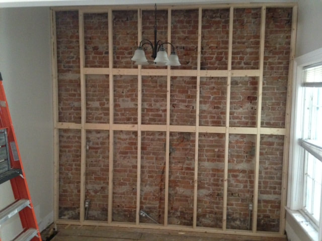 Kitchen wall taken down to the studs
