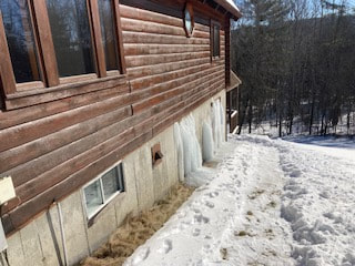 Ice builds up outside home in Lake George.