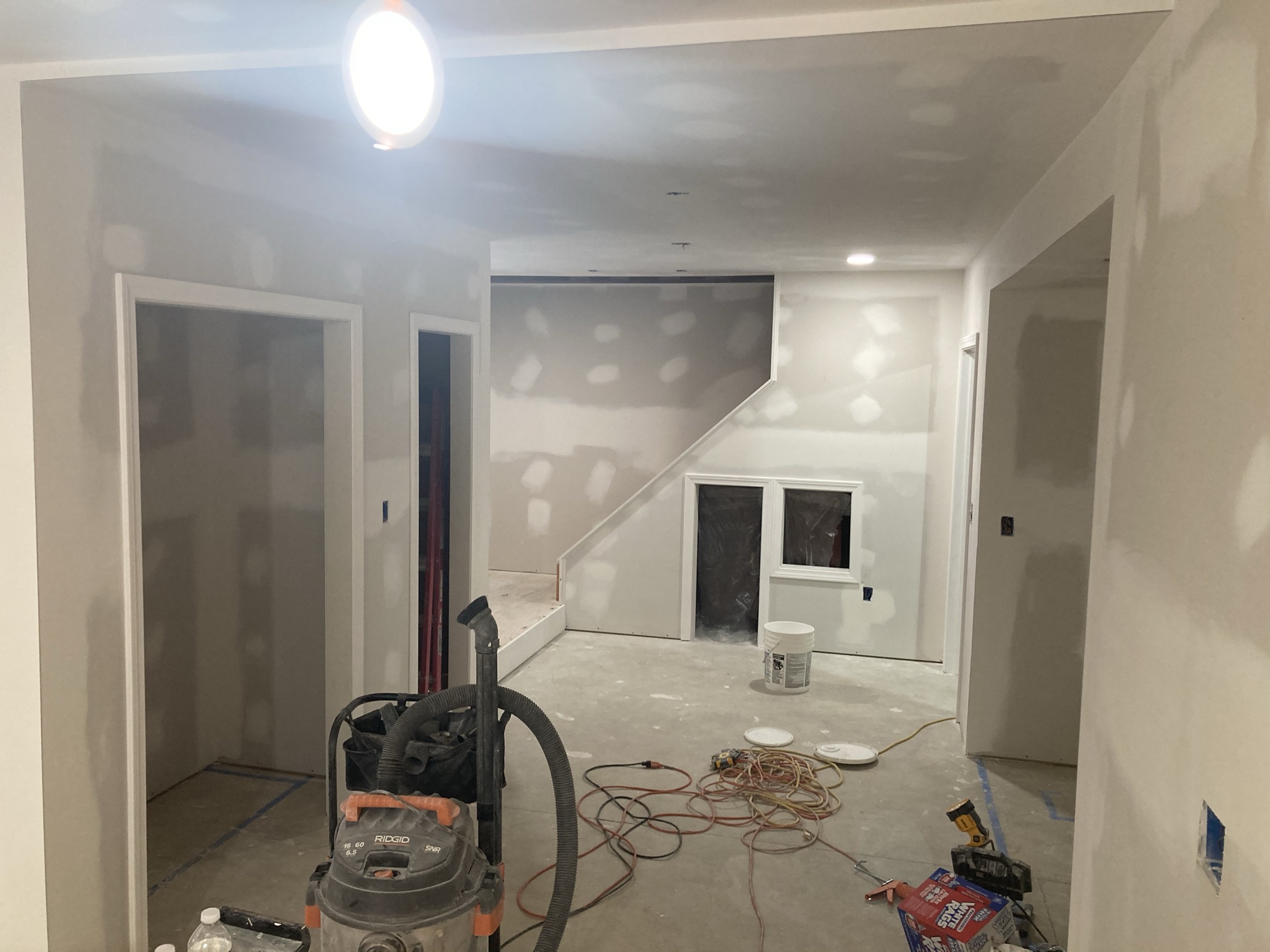 Basement with drywall hung and taped during finishing work