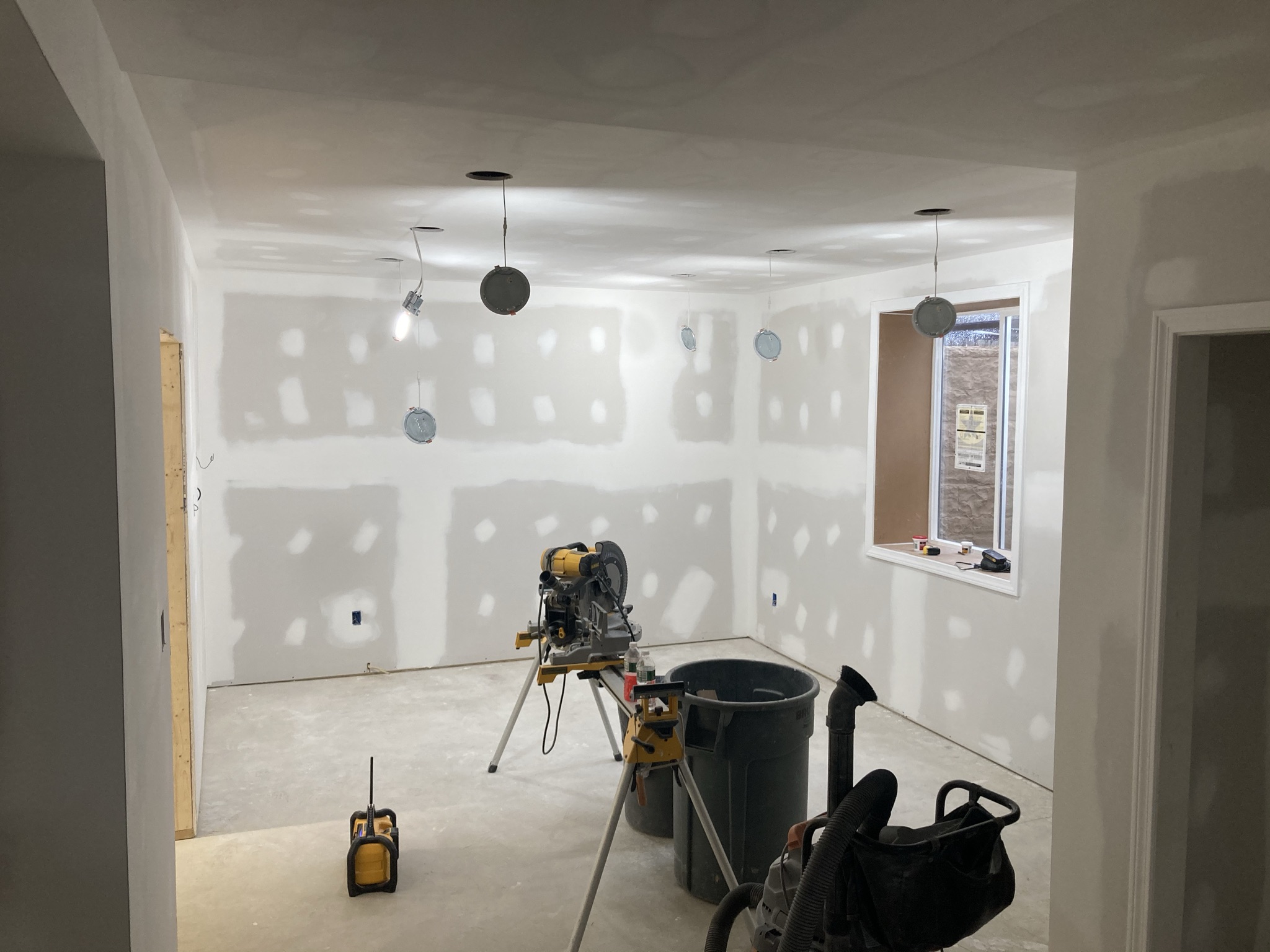 Basement with taped and mudded drywall nearing completion